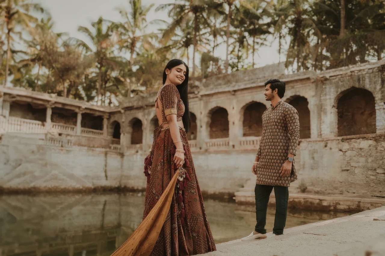 Karu Studio portrait of a couple together in a sunlit stone courtyard